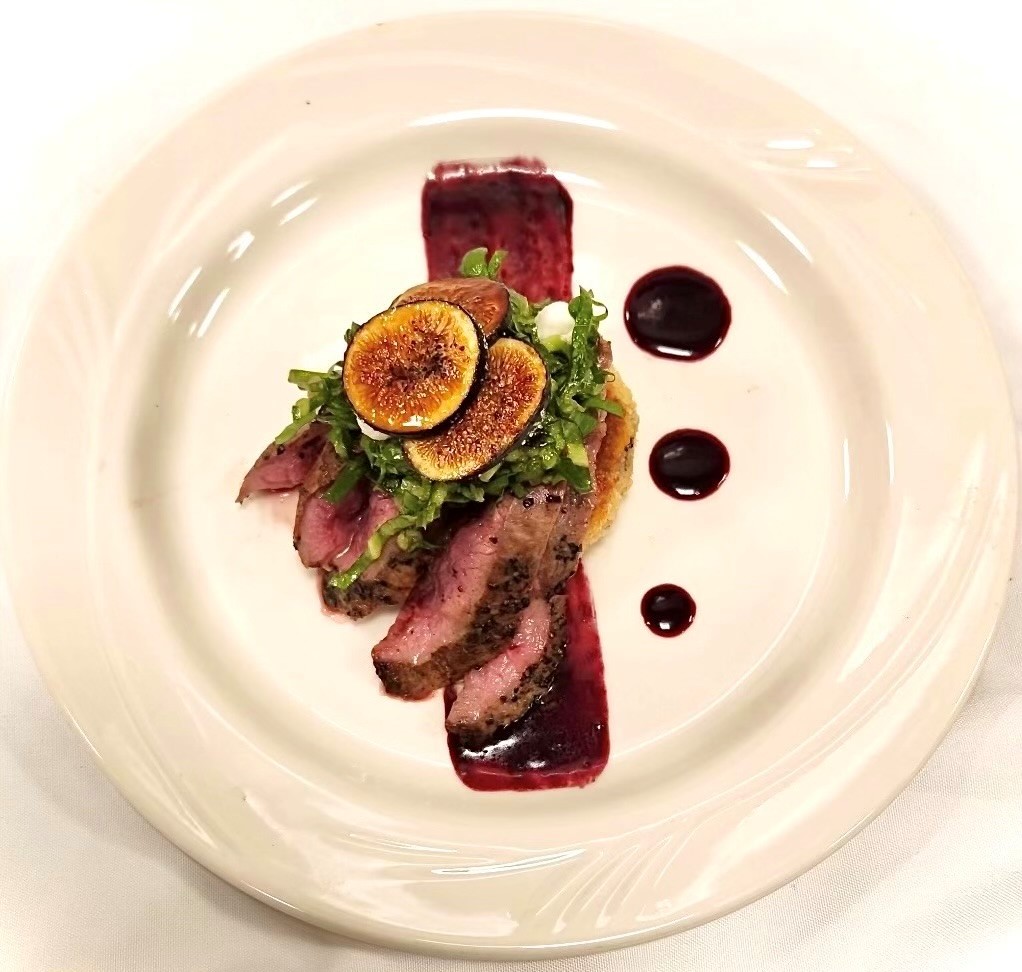 Pan-Seared Venison over Cowpea Cake with Blackberry Bordelaise Sauce